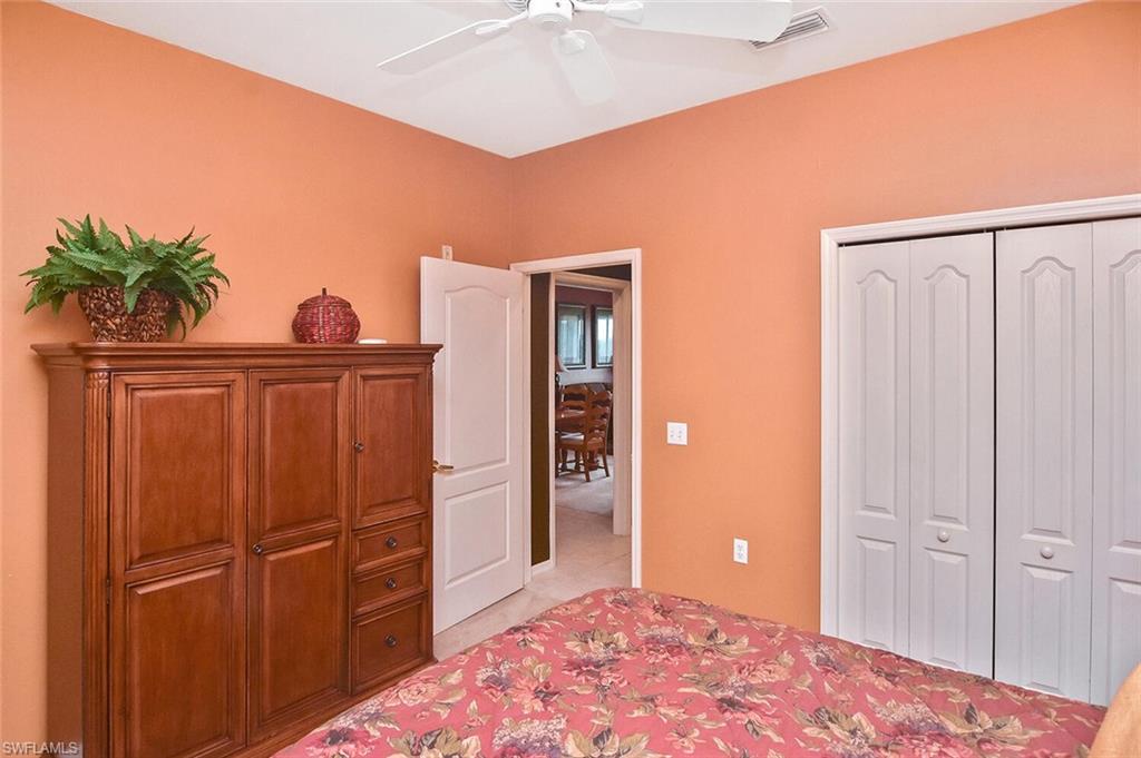 3800 Sawgrass Way, Unit 3143 Naples, FL 34112 - Photo 14 of 45 Bedroom featuring ceiling fan and a closet