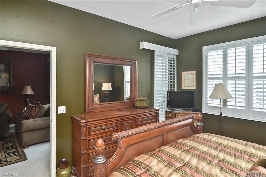 3800 Sawgrass Way, Unit 3143 Naples, FL 34112 - Photo 23 of 45 Carpeted bedroom with a ceiling fan