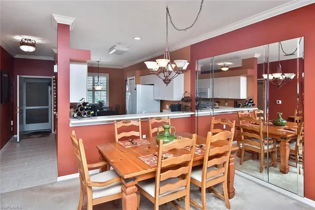 a very nice looking dining room with a table and chairs