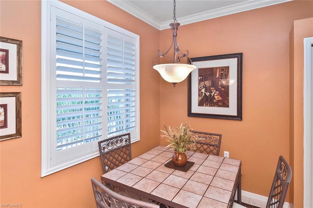 3800 Sawgrass Way, Unit 3143 Naples, FL 34112 - Photo 29 of 45 Dining area with crown molding