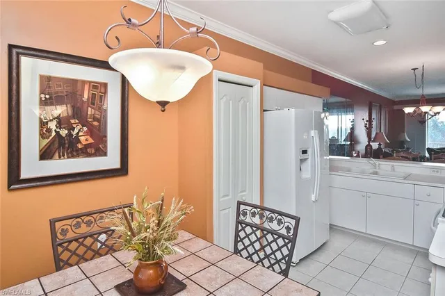 a kitchen with a sink cabinets and window