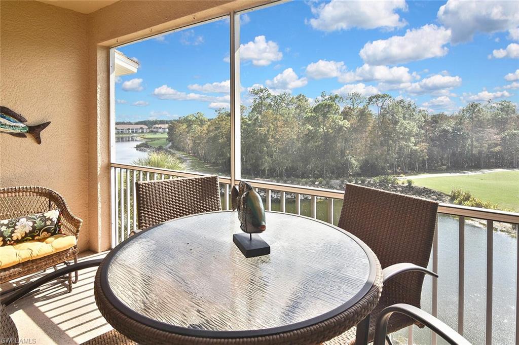 3800 Sawgrass Way, Unit 3143 Naples, FL 34112 - Photo 36 of 45 Balcony with a sunroom