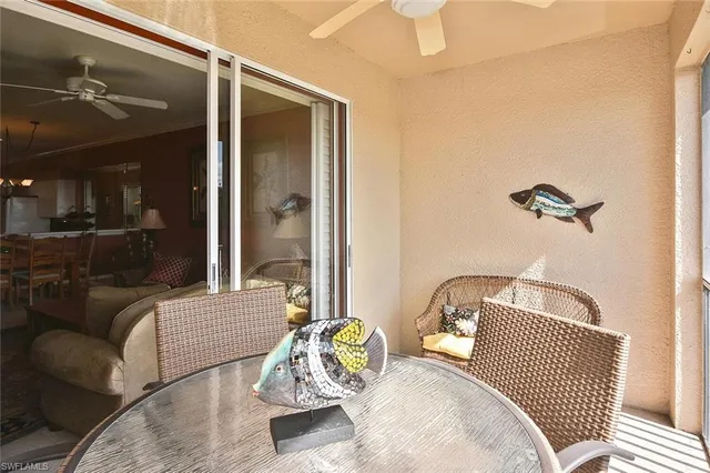 a view of a balcony with table and chairs