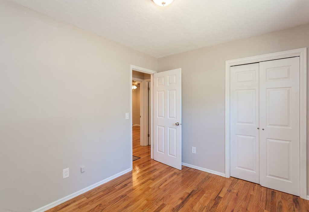 99 Sunnybrook Road Springfield, MA 01119 - Photo 16 of 30 a view of an empty room with wooden floor