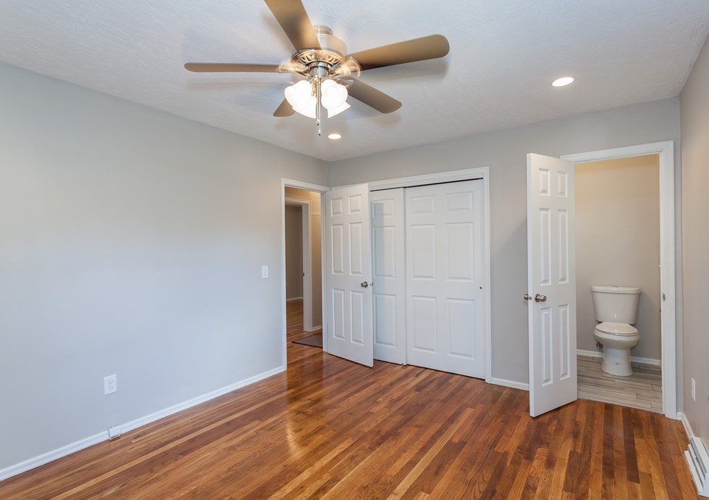 99 Sunnybrook Road Springfield, MA 01119 - Photo 18 of 30 wooden floor in an empty room with a bathroom