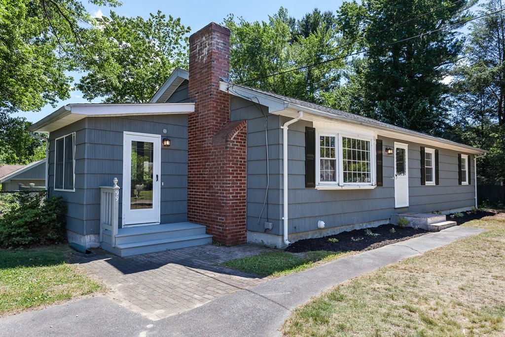 99 Sunnybrook Road Springfield, MA 01119 - Photo 26 of 30 a front view of a house with a garden