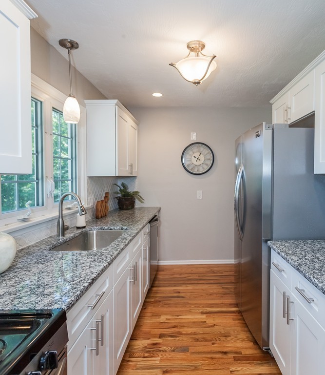 99 Sunnybrook Road Springfield, MA 01119 - Photo 3 of 30 a kitchen with granite countertop stainless steel appliances a sink stove and refrigerator