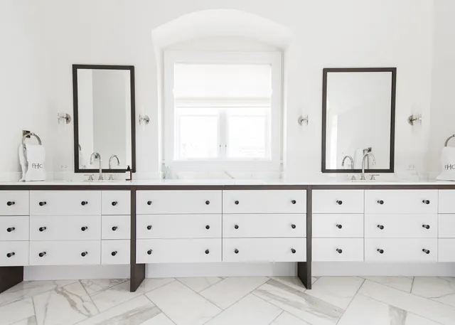 a bathroom with a sink vanity and mirror