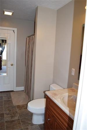 18 Barre Paxton Road Rutland, MA 01543 - Photo 10 of 17 a bathroom with a granite countertop sink toilet and shower