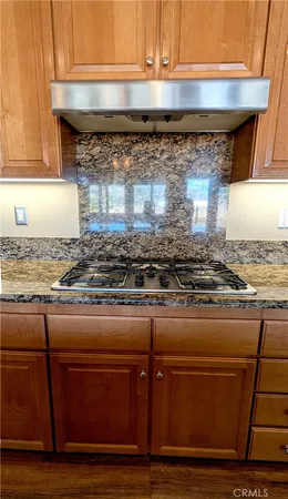 a kitchen with a stove and a microwave