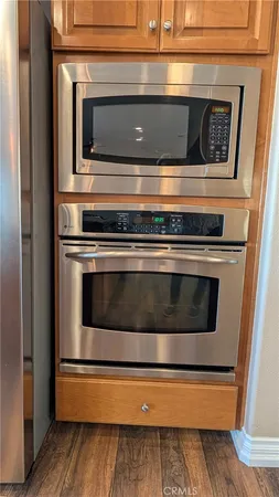 a stove top oven sitting inside of a kitchen