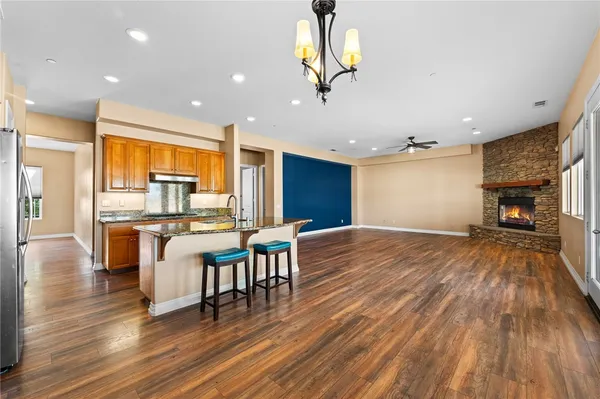 a view of a dining room with furniture wooden floor and chandelier