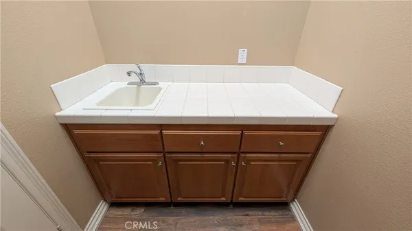 a bathroom with a sink and cabinets