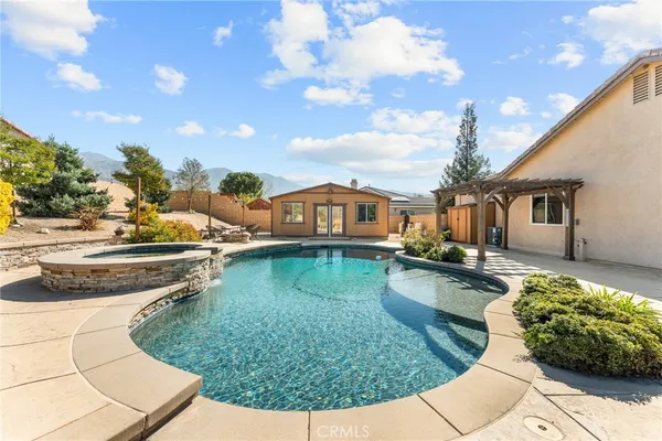 a view of a swimming pool with a patio