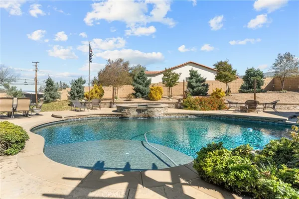 a view of a swimming pool with a lake view