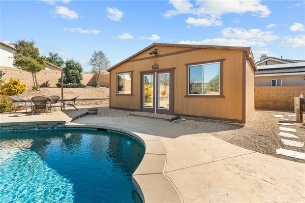 a front view of a house with swimming pool