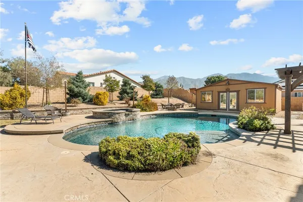 a view of a swimming pool with a patio
