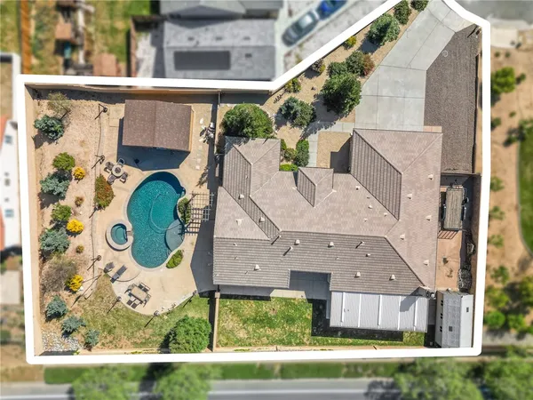 an aerial view of a house with a swimming pool