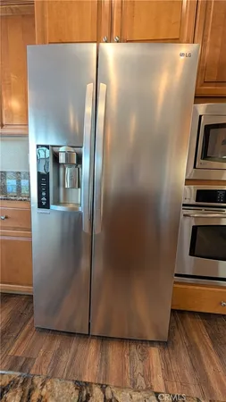 a view of a kitchen with wooden floor