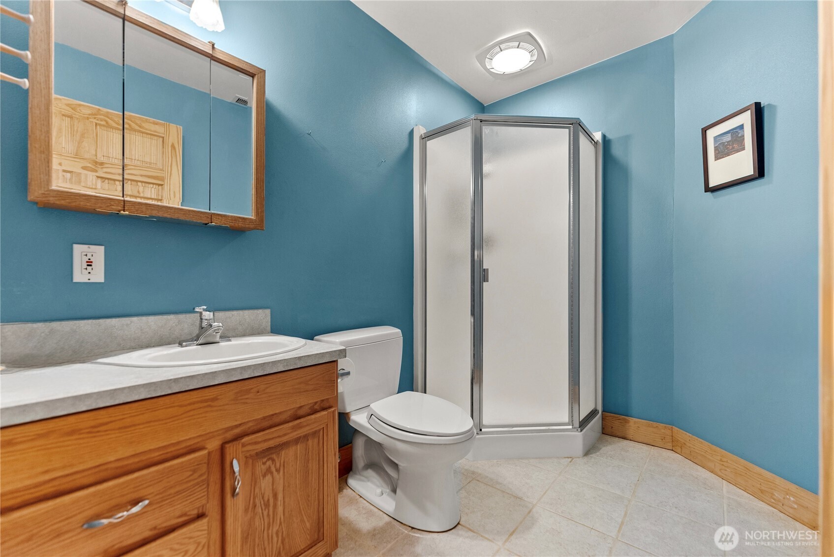 427 Rendezvous Road Winthrop, WA 98862 - Photo 32 of 40 a bathroom with a granite countertop sink mirror vanity and toilet