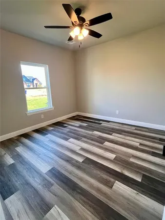 a view of room window and wooden floor