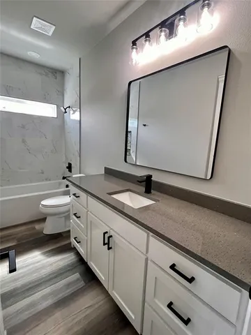 a bathroom with a double vanity sink and mirror
