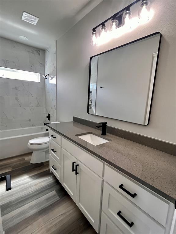 1404 Dixie Road Whitesboro, TX 76273 - Photo 12 of 35 a bathroom with a double vanity sink and mirror