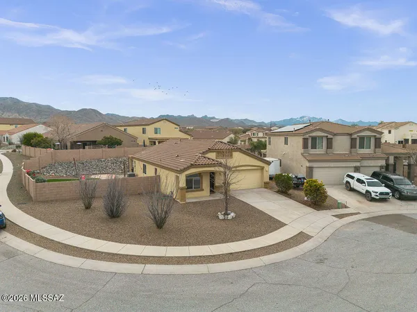 a view of a house with a yard from a tub
