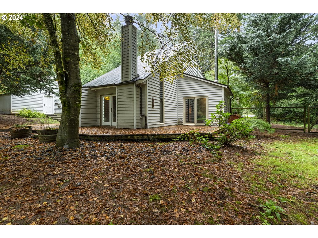 21565 Southeast Firwood Road Sandy, OR 97055 - Photo 36 of 42 a backyard of a house with lots of green space