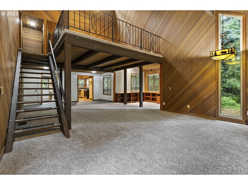 21565 Southeast Firwood Road Sandy, OR 97055 - Photo 6 of 42 a view of a hallway with stairs