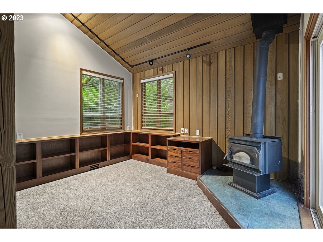 21565 Southeast Firwood Road Sandy, OR 97055 - Photo 9 of 42 a bedroom with furniture and a window