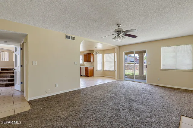 a kitchen with granite countertop cabinets stainless steel appliances and a sink