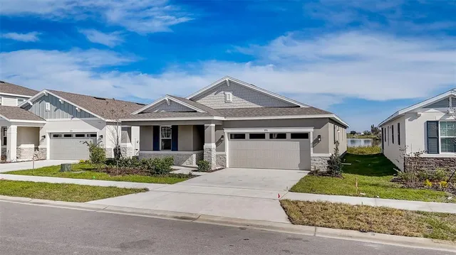 an aerial view of a house with lake view and city view