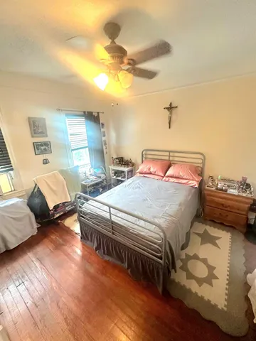 a bedroom with two beds and a couch