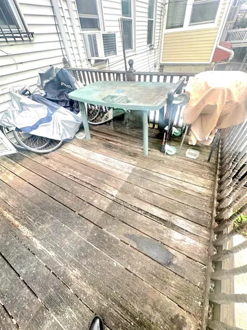 a front view of a building with sitting area