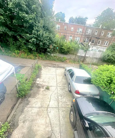 a view of a balcony with yard