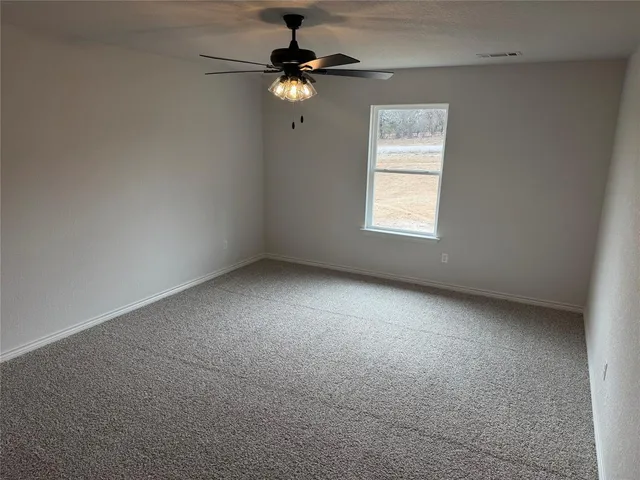 a kitchen with a sink and a refrigerator