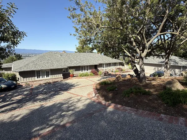 a view of house with outdoor space