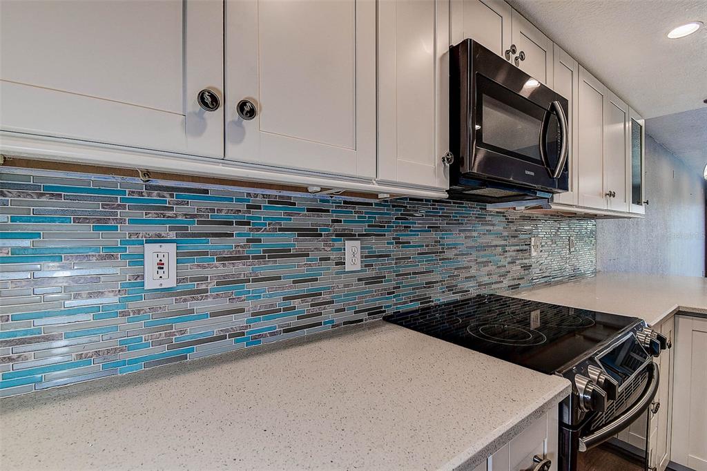 14865 Seminole Trail Seminole, FL 33776 - Photo 14 of 54 a kitchen with a stove and a microwave