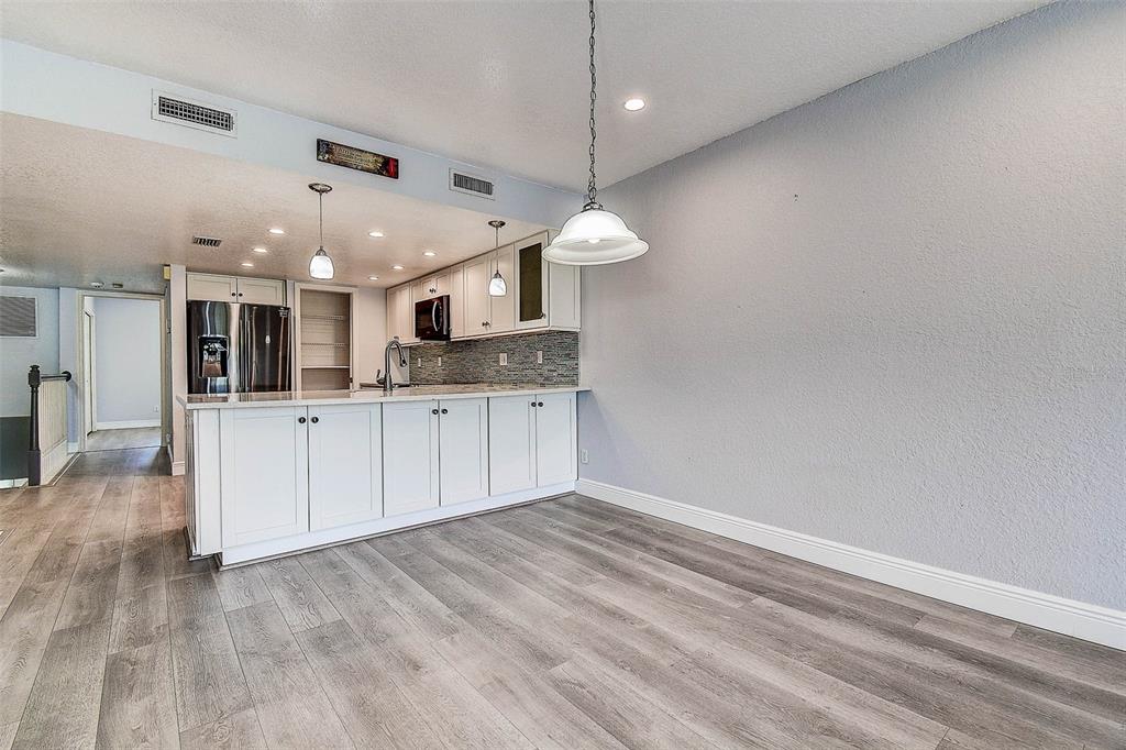 14865 Seminole Trail Seminole, FL 33776 - Photo 15 of 54 a view of a kitchen with a sink and a refrigerator