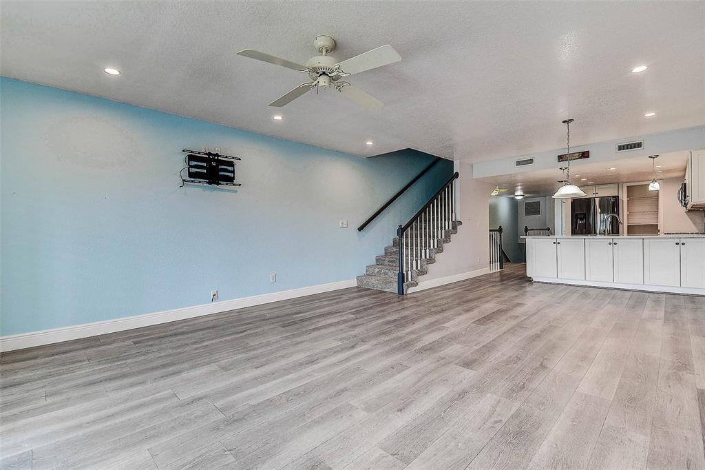14865 Seminole Trail Seminole, FL 33776 - Photo 16 of 54 an empty room with wooden floor and hallway