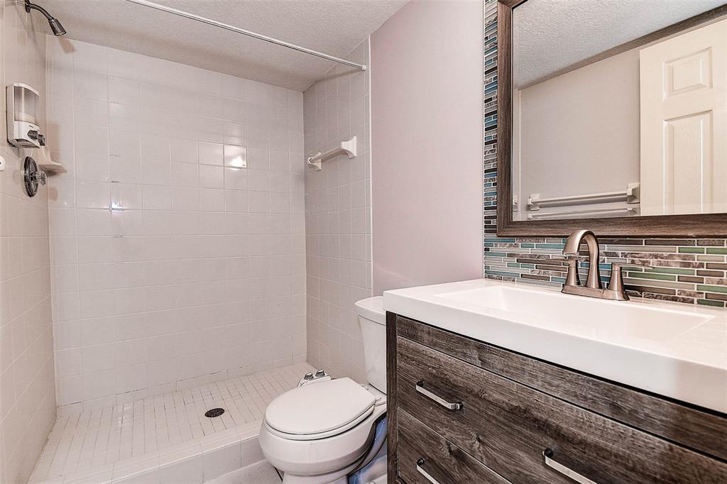 14865 Seminole Trail Seminole, FL 33776 - Photo 18 of 54 a bathroom with a sink toilet vanity and shower