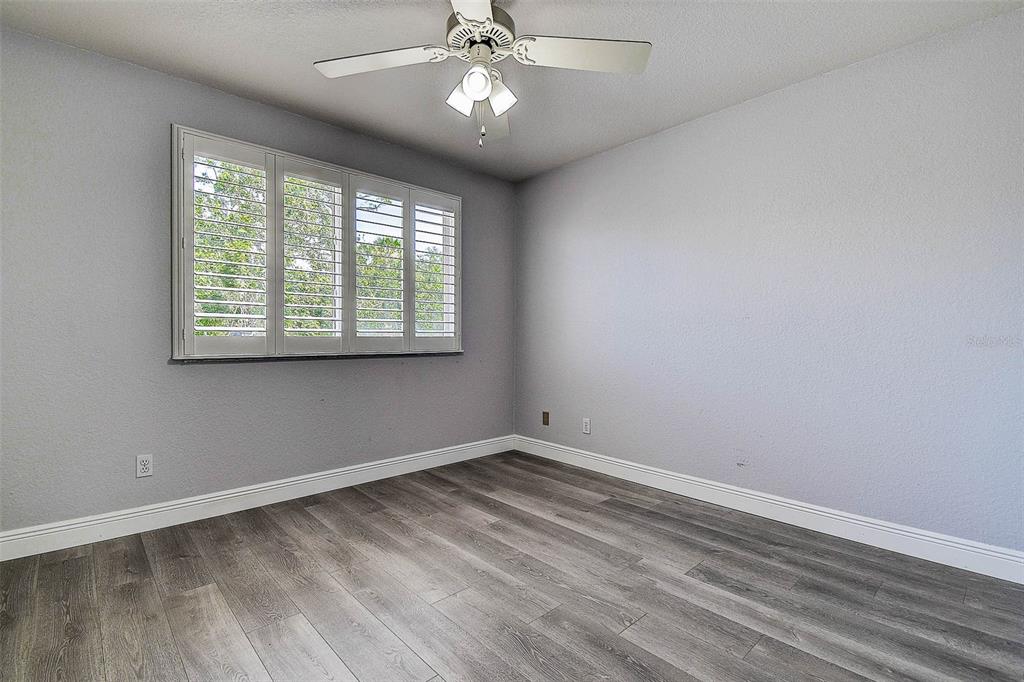 14865 Seminole Trail Seminole, FL 33776 - Photo 19 of 54 wooden floor in an empty room with a window