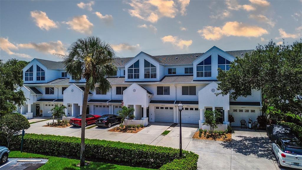 14865 Seminole Trail Seminole, FL 33776 - Photo 2 of 54 a front view of a house with yard and tree s