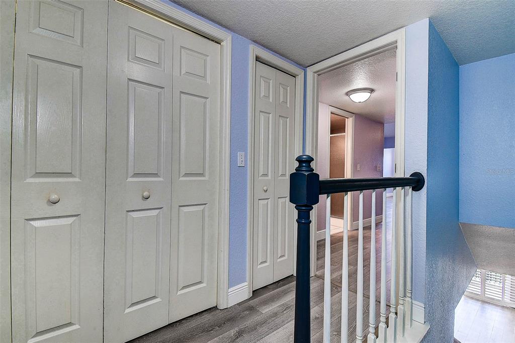 14865 Seminole Trail Seminole, FL 33776 - Photo 22 of 54 a view of a hallway with wooden floor and staircase