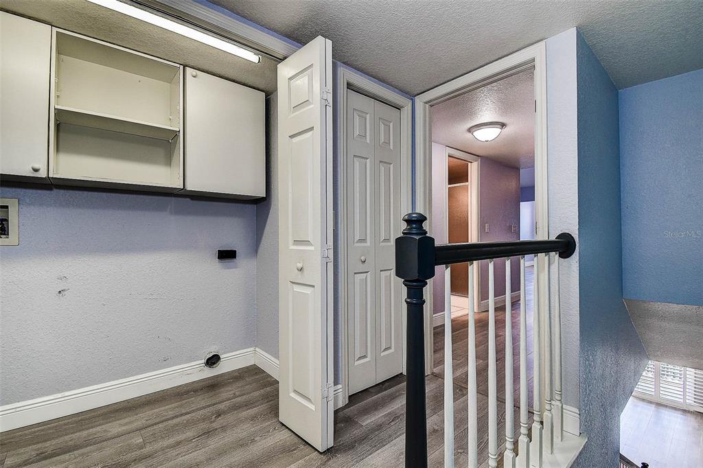 14865 Seminole Trail Seminole, FL 33776 - Photo 23 of 54 a view of a hallway with entryway wooden floor and front door