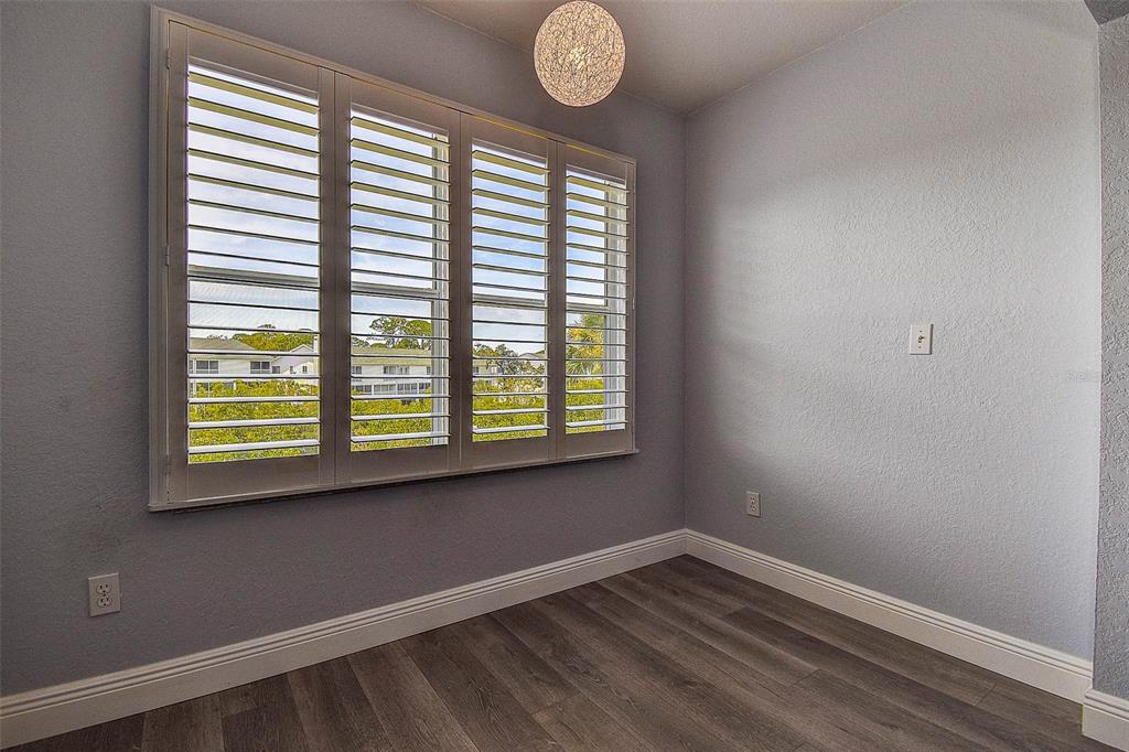 14865 Seminole Trail Seminole, FL 33776 - Photo 28 of 54 a view of an empty room with wooden floor and a window
