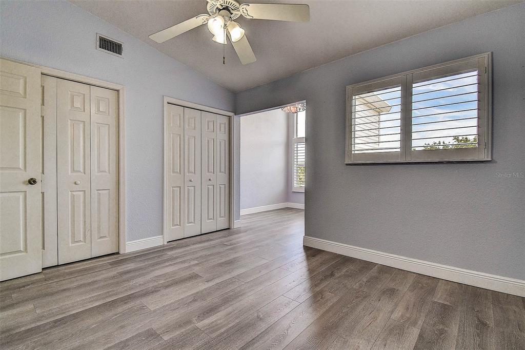 14865 Seminole Trail Seminole, FL 33776 - Photo 32 of 54 a view of an empty room with wooden floor and a window