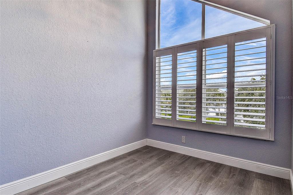 14865 Seminole Trail Seminole, FL 33776 - Photo 33 of 54 a view of an empty room with a window and wooden floor