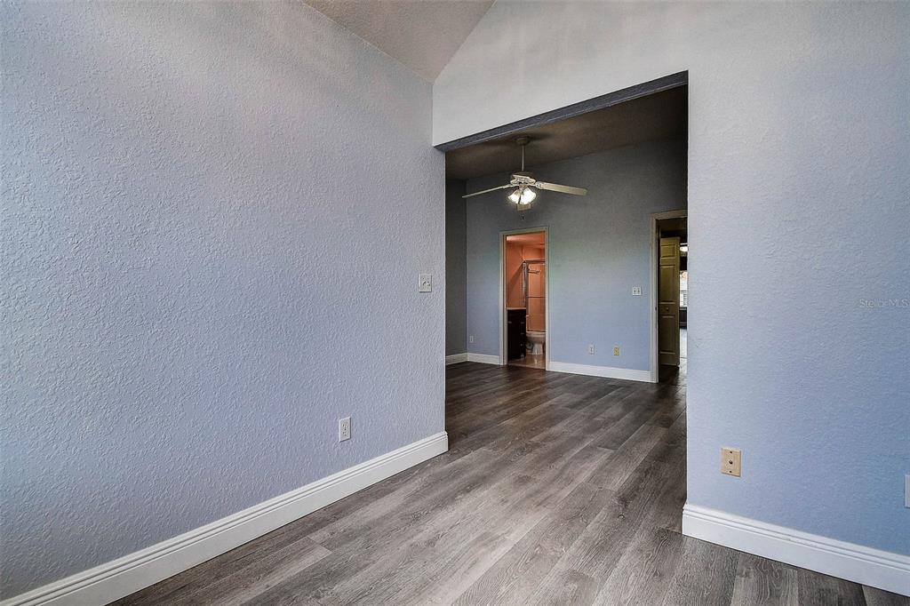 14865 Seminole Trail Seminole, FL 33776 - Photo 34 of 54 an empty room with wooden floor and closet